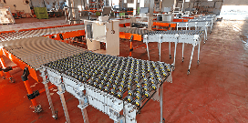 Rows of expandable flexible conveyors  lined up on a warehouse floor