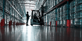 Small forklift-in-warehouse image showing the truck and surrounding floor space.